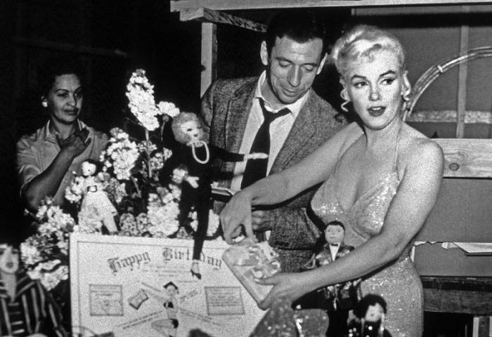 French Actor Yves Montand, American Actress Marilyn Monroe and a birthday cake. a English Photographer, (20th century)