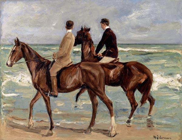 Uomini a cavallo sulla spiaggia