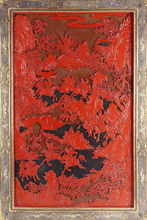 A Filigree Framed Red Lacquer Panel Depicting Warriors On Horseback And Mythical Animals In A Landca a 