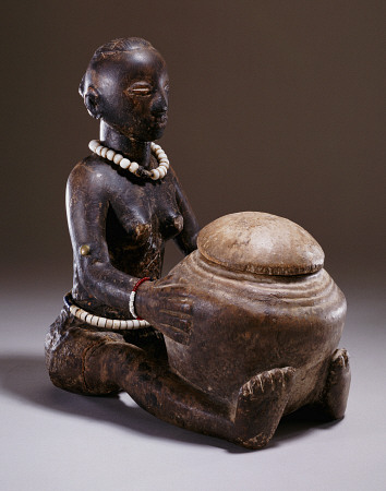 A Luba Figure Of A Seated Female Holding A Round Bowl a 