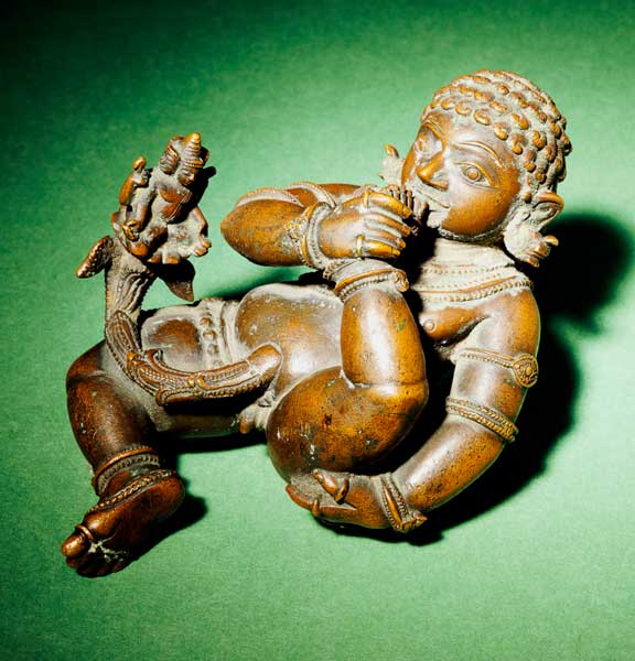 A South Indian Bronze Figure Of Vatapattrasayin, Vishnu In His Incarnation As Krishna, Depicted As A a 