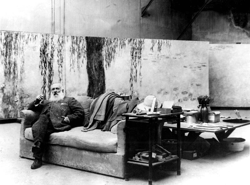 French painter Claude Monet in his workshop in front of one of his paintings Waterlilies a 