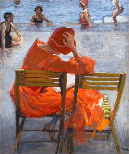 Giovane donna in abito rosso in piscina